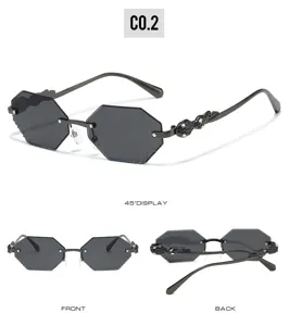 Detail view of rimless polygonal sunglasses, featuring rhinestone encrusted temple and dark lens.