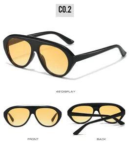 Detail view of the stylish shield sunglasses with thick PC frame and yellow gradient lenses.