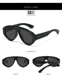 Detail view of black fashion sunglasses, stylish chunky frame with metal rivet accents.