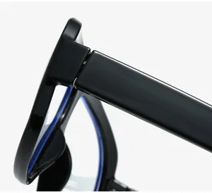 Close up detail view of black thick frame glasses temple and hinge, minimalist design.