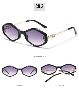 Cat eye sunglasses with black geometric frame, gradient lenses and crystal heart decor.