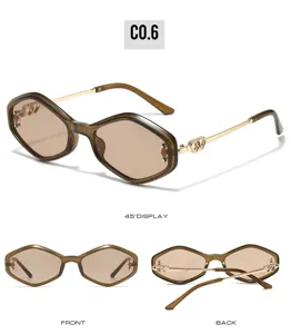 Detail view of trendy cat eye sunglasses with metal frame and chic heart temple decor.