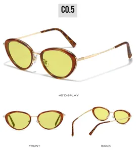 Trendy oval metal sunglasses for women with tortoise frame and yellow lenses detail