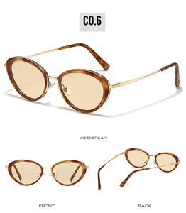 Detail view of vintage oval metal sunglasses with tortoise frame and gold temples.