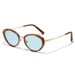 Trendy tortoiseshell oval sunglasses for women with light blue lenses and gold metal frames.
