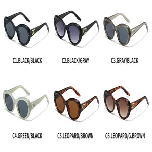 Trendy cat-eye sunglasses with double heart decor, stylish oval frames for women and men.