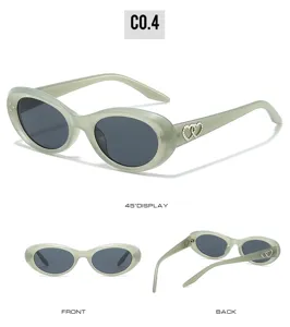 Trendy fashion cat-eye sunglasses featuring oval frames and chic double heart temple decor.