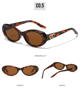 Retro tortoiseshell oval sunglasses featuring trendy gold double heart temple details