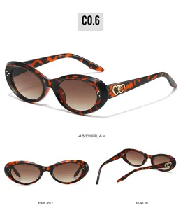 Trendy oval cat-eye sunglasses for men and women with tortoise shell and heart temples.