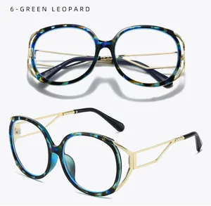 Retro cat-eye blue light blocking glasses with green leopard print and gold metal frame details.