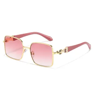 Elegant square sunglasses for women with gold frame and pink gradient lenses for chic style.