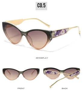 Trendy cat-eye sunglasses with gradient lenses and stylish patterned temples for women and men.