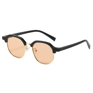 Women's half-frame sunglasses with chic black browline, gold metal rim and trendy round lenses.