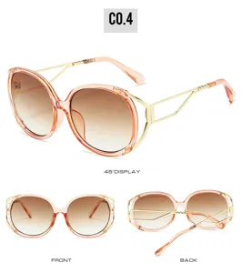 Oversized oval sunglasses detail, gradient lenses, geometric metal temples, chic street style.