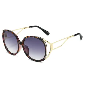 Oversized oval sunglasses for women, gradient purple lenses with chic gold temples. Main view.
