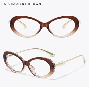 Gradient brown oval glasses frame detail with pearl temple decoration and metallic finish.
