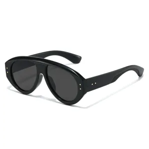 Black oversized flat top sunglasses with gold rivet details for women and men street style.