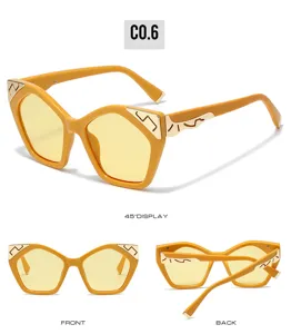 Fashion cat eye sunglasses for women with trendy yellow frame and gold temples street style.
