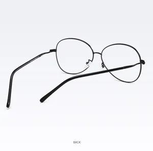 Detailed view of the 1945 oval metal eyeglass frame with curved temples in classic black.