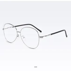 Detailed view of a stylish Korean style oval metal eyeglass frame with curved black temples.