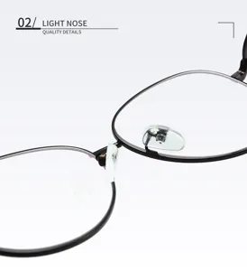 Close-up detail of Korean style oval metal eyeglass frame nose pads and bridge.