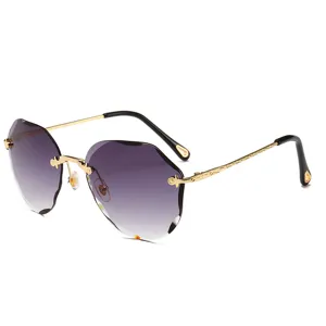 Chic rimless gradient sunglasses with stylish scalloped lenses and elegant gold metal temples.
