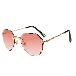 Fashion rimless gradient pink sunglasses with diamond cut edges and elegant gold temples.