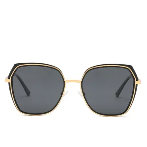 Stylish women's polygon sunglasses with black gold frames and dark lenses for outdoor wear.