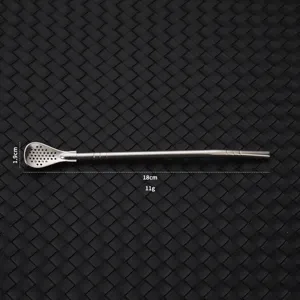 Detailed view of the stainless steel yerba mate straw spoon showing size and filter design.