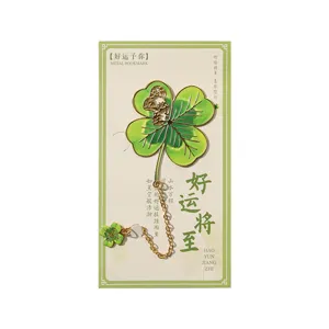 Exquisite vintage metal four leaf clover bookmark with chain and pendant for reading lovers.