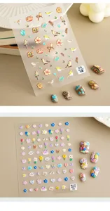 Detailopname van schattige 3D reliëf nagelstickers met bloemen en vogels voor unieke nail art.