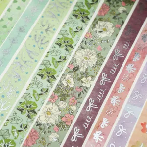 Kit de rubans adhésifs washi fleurs et nœuds pour la décoration de journal DIY et papeterie.