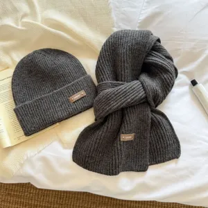 Dark grey knitted beanie and scarf set for women, cozy winter thermal neck protection wear.