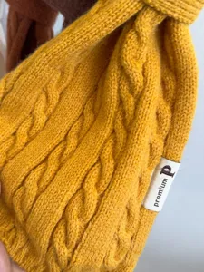 Cozy cable knit winter scarf in vibrant yellow, featuring a soft texture for warm daily wear.