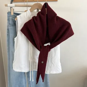 Knit hollow shawl for women, stylish autumn winter fashion neck warmer and versatile outerwear piece.