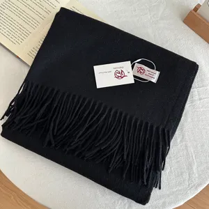 Classic solid black wool scarf with fringe, warm winter long fashion accessory for men and women.