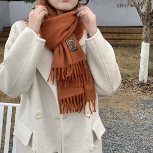 Cozy winter solid color tassel scarf for women and men, soft warm knit fashion neck wrap.