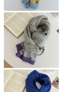 Detailed close-up view of women winter knitted scarf with colorful dots and ribbed texture.