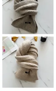 Cozy knitted winter scarf in solid oat color, thick warm wool-blend fabric for daily style.