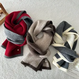Cozy color-block wool winter scarf for women, stylish warm neck wrap for cold weather.