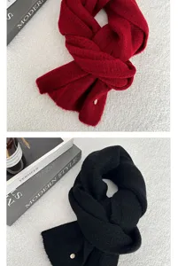 Detailed view of soft winter knitted scarf, cozy solid color design, warm fabric texture.