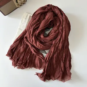 Detailed close up view of brown cotton linen pleated plaid scarf retro literary style