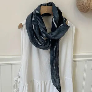 Detailed view of the dark grey tie-dye long thin scarf with unique wrinkles and soft texture.