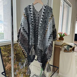 Ethnic knitted tassel poncho shawl for women, cozy winter travel cape and outer wear.
