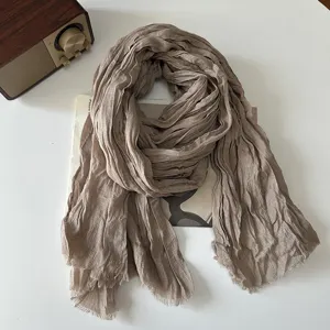 Detailed view of women's solid color pleated linen scarf, retro literary autumn winter style.