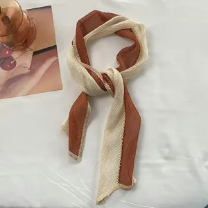 Pleated color-block small silk scarf, elegant hair accessory for women detail view.