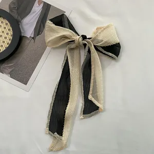 Pleated contrast ribbon hair bow, elegant black and beige silk scarf tie for styling hair.
