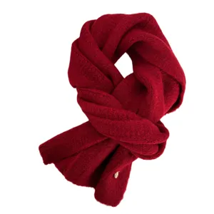 Solid red knitted winter scarf for women and men, soft, warm and cozy wrap style.