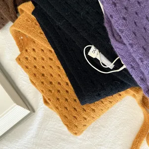 Hollow knitted triangular scarf, pure wool warm shawl for women, stylish solid color winter accessory.