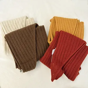 Early autumn 100% wool knit shawl, cozy corn stitch fashion scarf for women detail view.